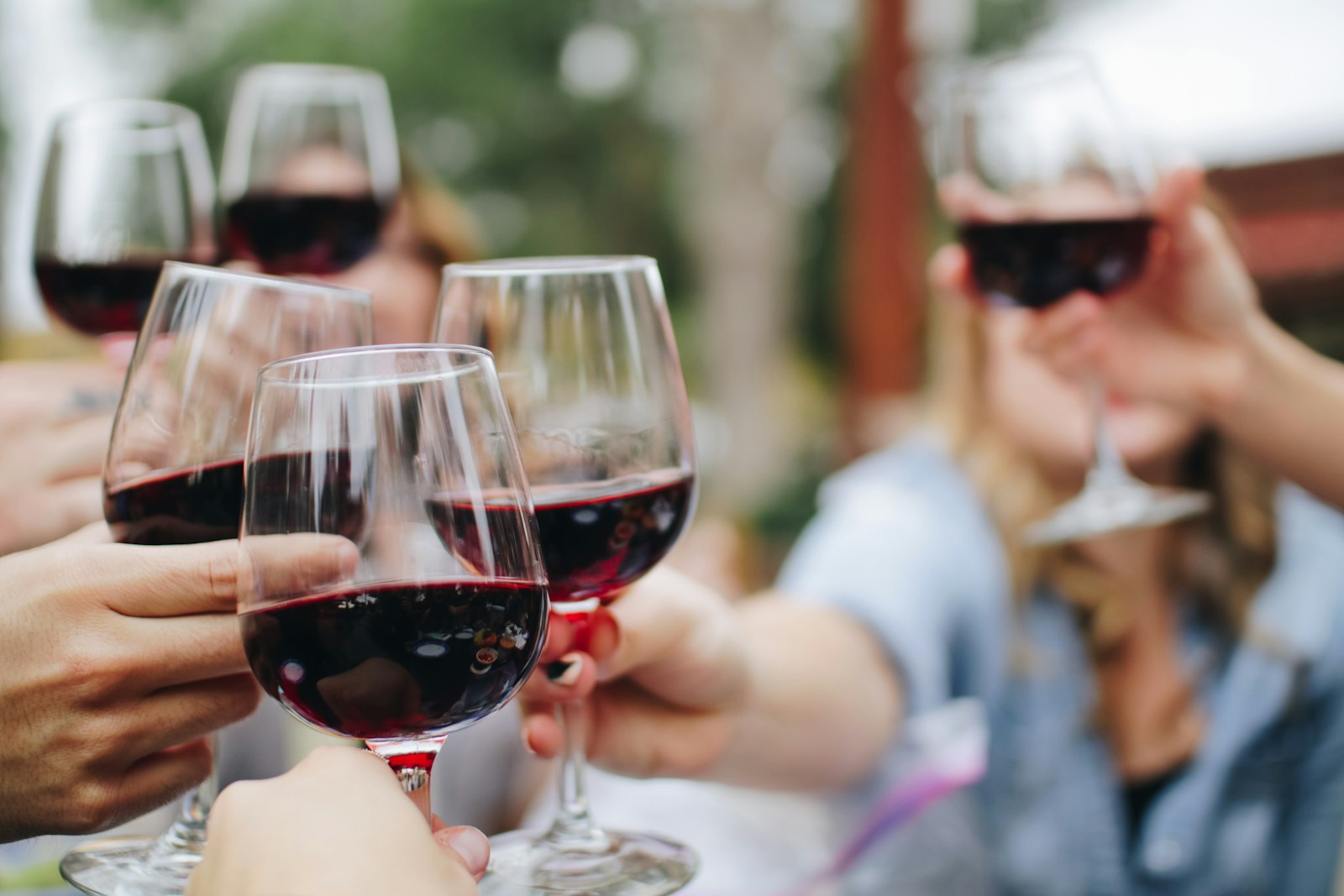 Wine glasses raised in celebration